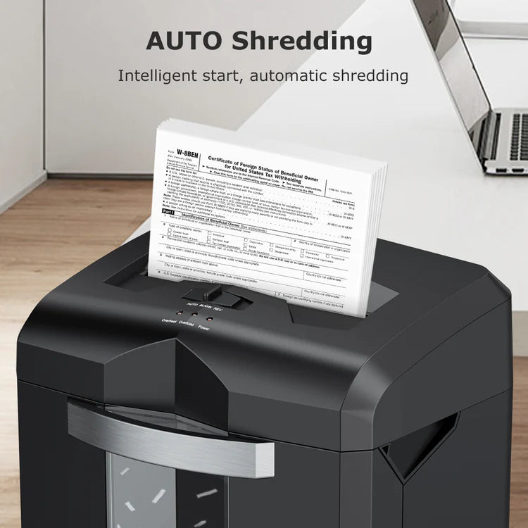 Black paper shredder with a document being shredded, placed on a wooden surface. Businessential Bonsaii C149-C