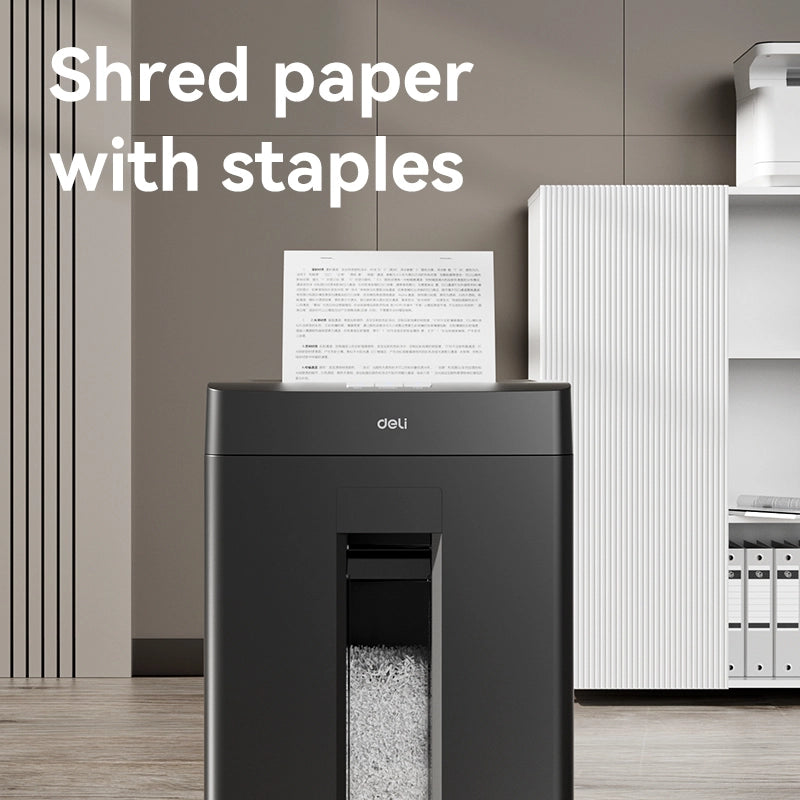 Black paper shredder with a piece of paper on top in an office setting DELI T094 Paper Shredder