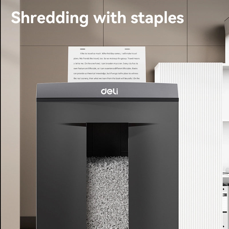 Shredder with a piece of paper labeled 'deli' on top, set against a neutral background. Deli ET095 Paper Shredder