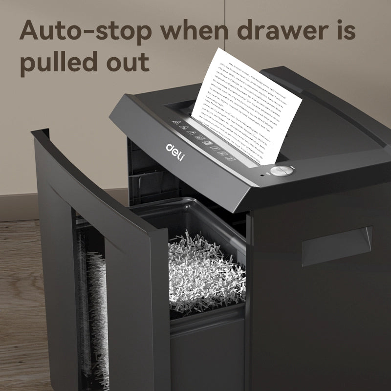 Shredder with a document being shredded, labeled 'Auto-stop when drawer is pulled out'. Deli ET095 Paper Shredder