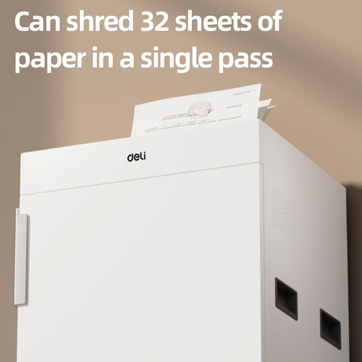 White paper shredder with text indicating it can shred 32 sheets of paper in a single pass, against a beige background.